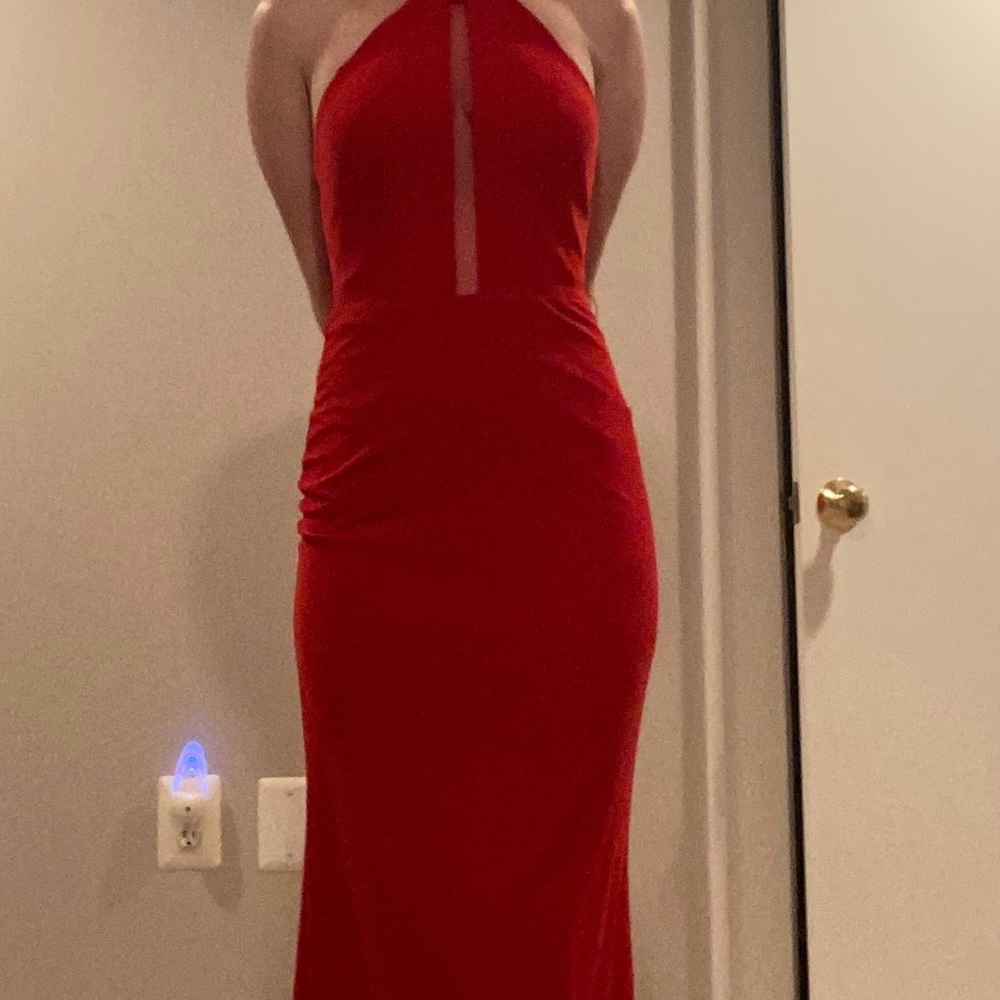 Red gown, like new. Never worn out only tried on at home.